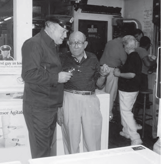 Irv “Bubba” Lippton (center) doing business with the Maytag man Gordon Jump, c. 1990.