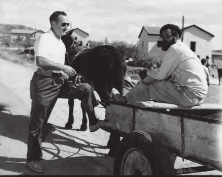 Sidney Gluckman (left) visits a kibbutz on a